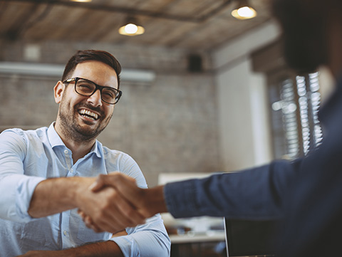 Man shaking hands with another agent