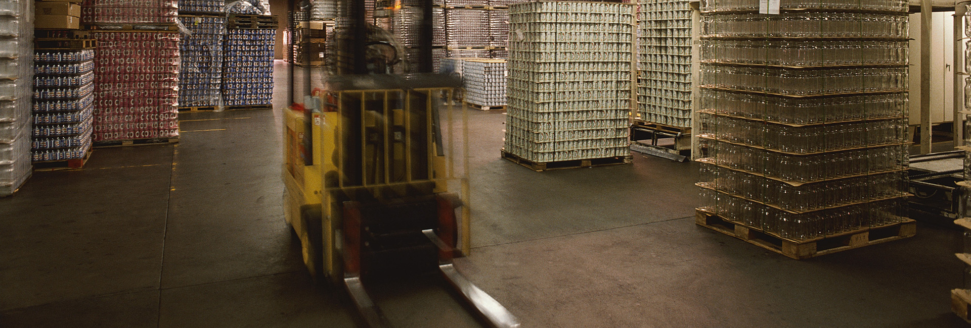 Forklift moving through a warehouse